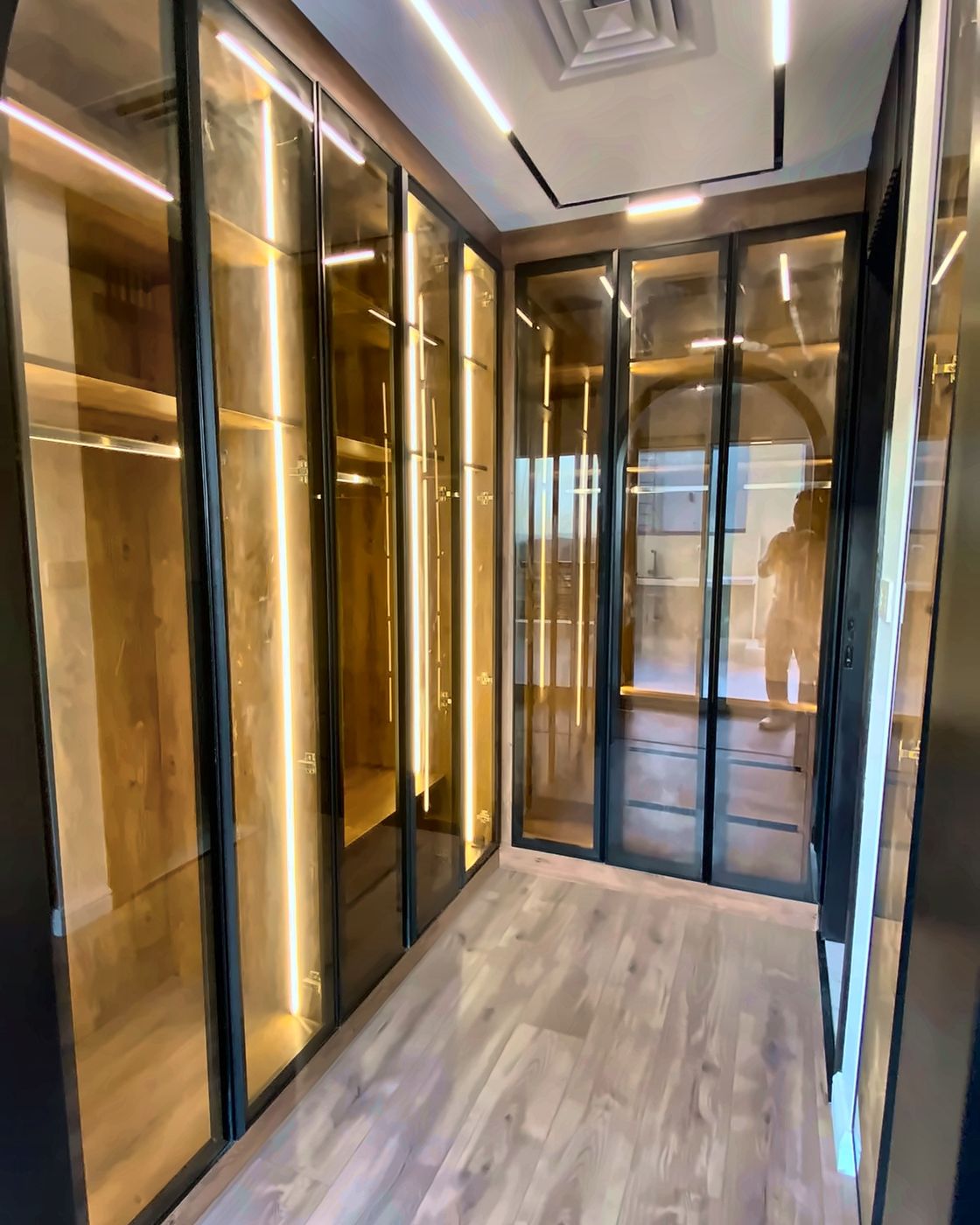Black frame glass wardrobes with wooden shelves, New Giza